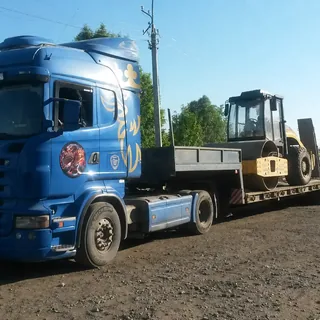 Перевозка грунтового катка на низкорамном трале