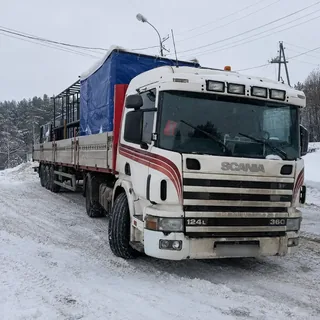 Перевозка крупногабаритного груза на бортовом грузовике зимой