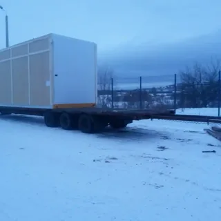 Перевозка крупногабаритного модульного блока на трале зимой