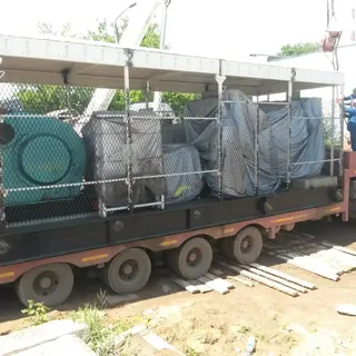 Перевозка промышленного оборудования на низкорамном трале с защитным ограждением