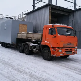 Перевозка промышленного модуля на трале зимой
