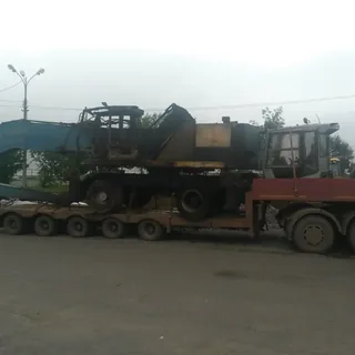 Перевозка колёсного экскаватора Terex на низкорамном трале
